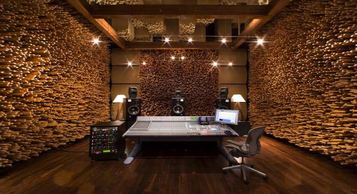 Recording room with microphone and acoustic wall panels